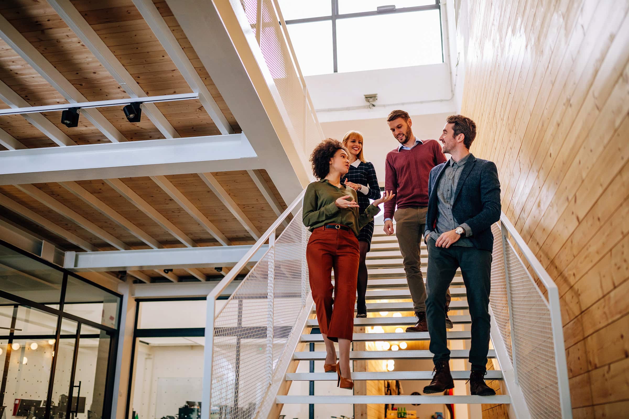 Group of coworkers going down the stairs