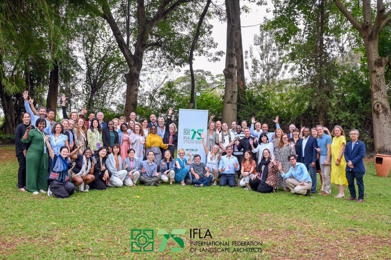 Group of IFLA world congress attendees posing outside in Nairobi, Kenya