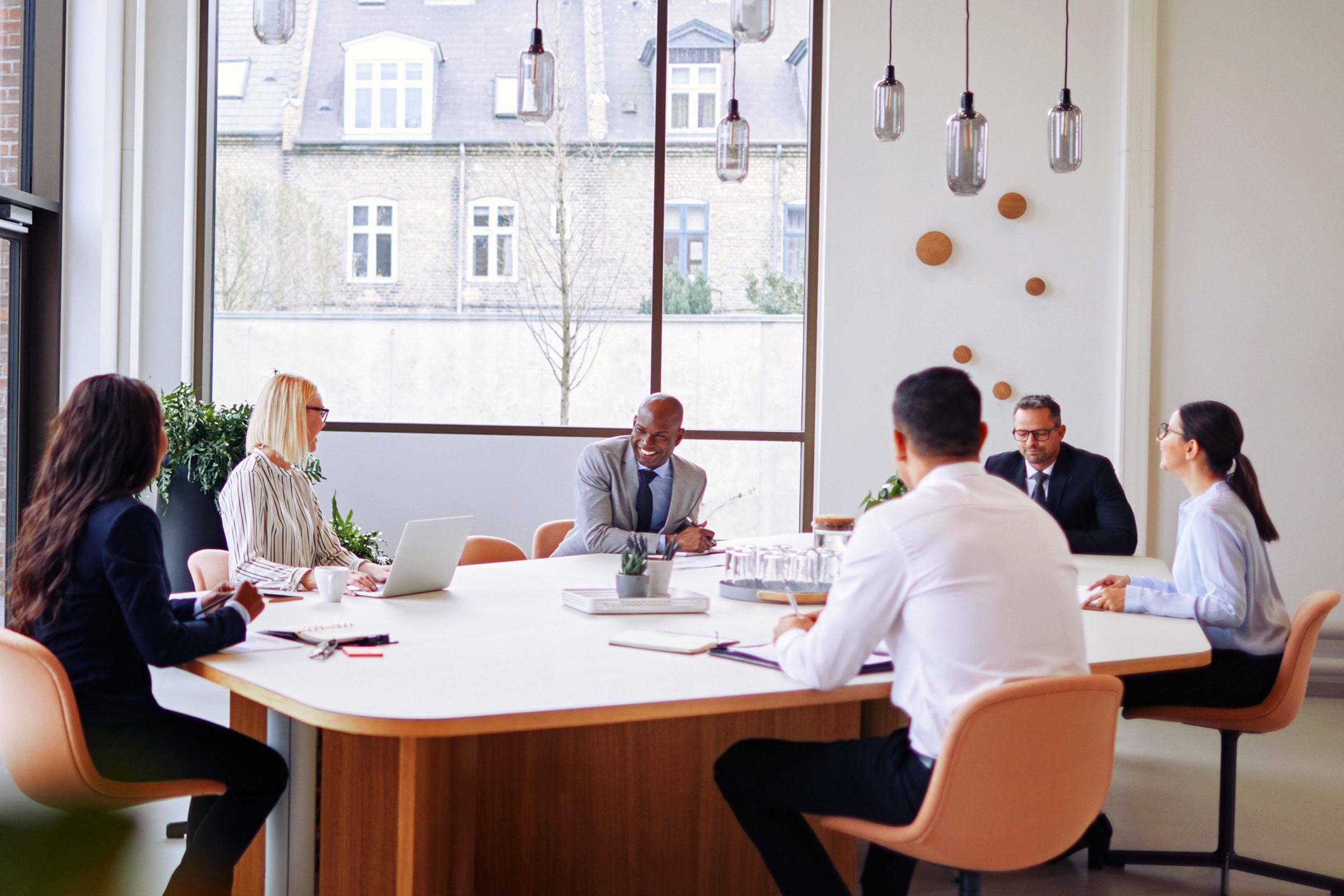 Smiling group of businesspeople having a meeting together