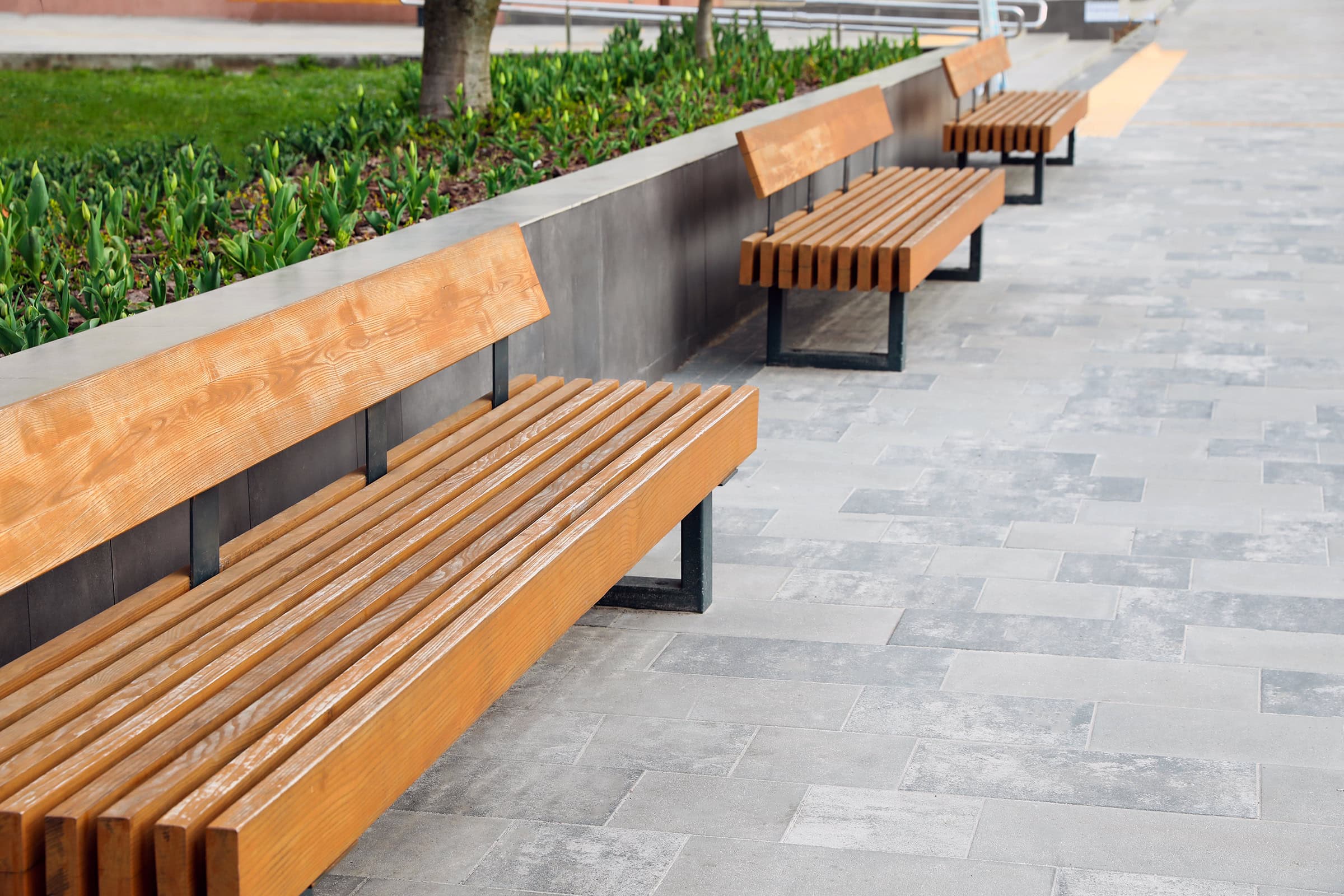 comfortable-wooden-chairs Paved city street with comfortable wooden benches