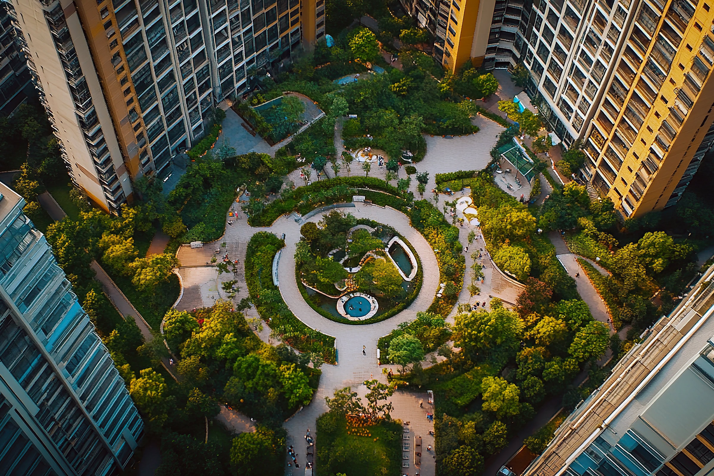 Aerial-view-complex-courtyard Aerial view urban oasis, apartment complex courtyard.