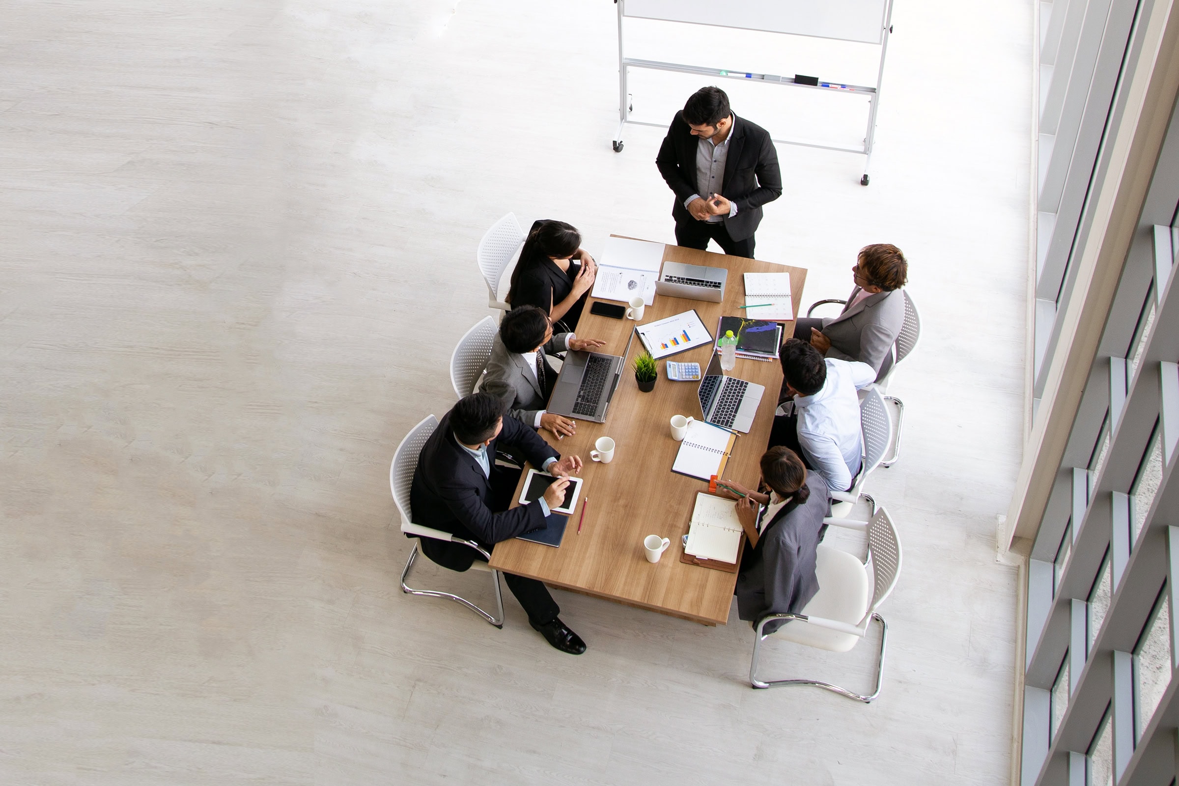 Top view of group of multiethnic busy people working in an office.