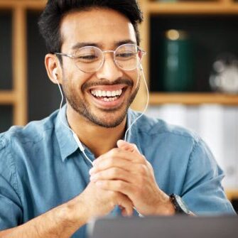 Happy asian man using laptop for a video call.