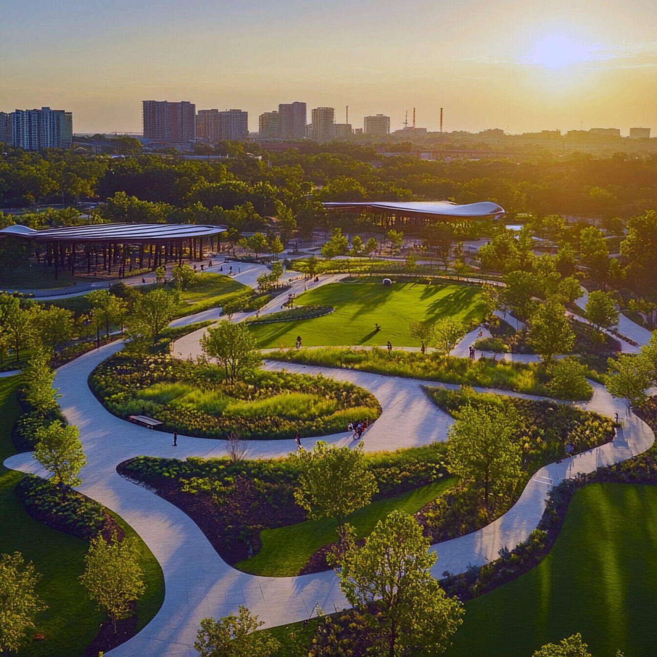 Scenic park at sunset, aerial view, winding paths, green landscape
