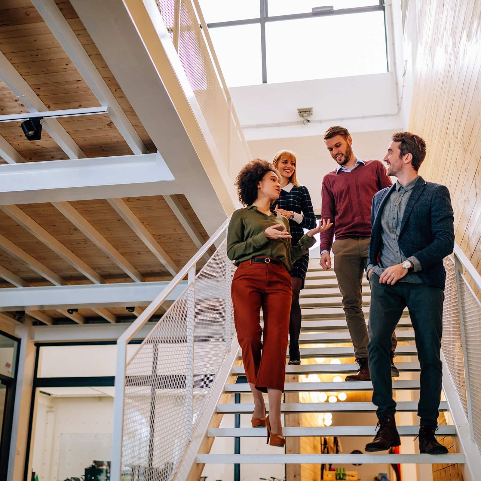 Group of coworkers going down the stairs